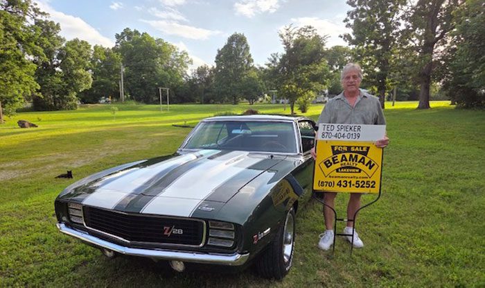 Ted Spieker with Beaman sign